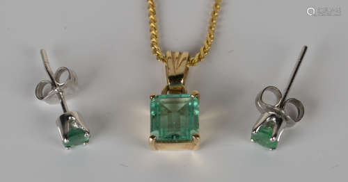 A gold and emerald single stone pendant, claw set with a cut cornered rectangular step cut