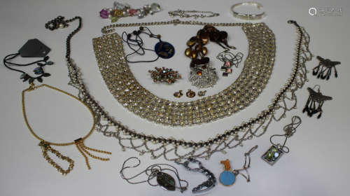 A collection of costume jewellery, including a colourless paste set belt, brooches, pendants and