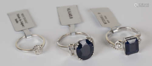 A silver, sapphire and colourless topaz set ring, a silver and diamond set cluster ring, a silver,