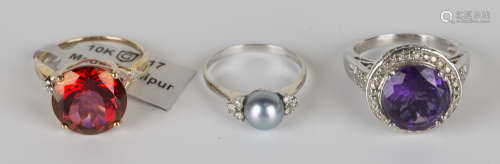 A white gold, grey tinted cultured pearl and diamond ring, mounted with the grey tinted cultured