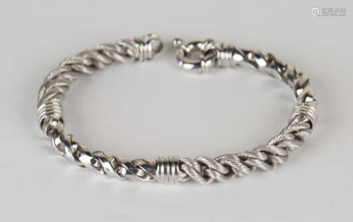 An 18ct white gold bracelet in a textured and alternating polished multiple link design, on a