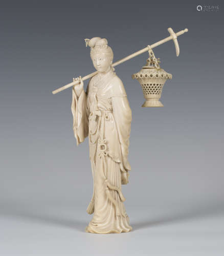A Chinese carved ivory figure of a lady, late Qing dynasty, the standing maiden finely modelled