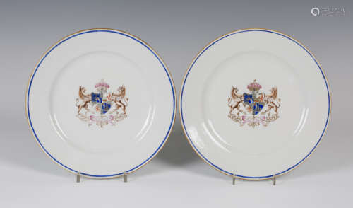 A pair of Chinese armorial porcelain plates, 19th century, each centre enamelled and gilt with a