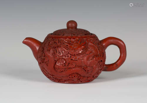A rare Chinese cinnabar lacquered Yixing stoneware teapot and cover, late Qing dynasty, the