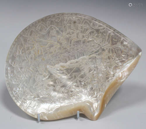 A Chinese carved mother-of-pearl shell panel, late Qing dynasty, one side carved in low relief