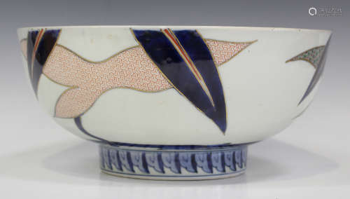 A Japanese Imari porcelain punch bowl, Meiji period, painted and gilt inside and out with abstract