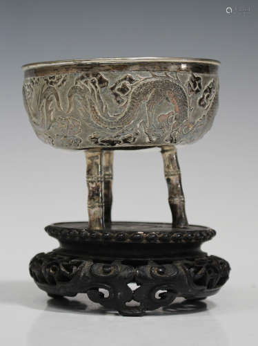 A Chinese silver bowl, late 19th/early 20th century, the circular body decorated in relief with