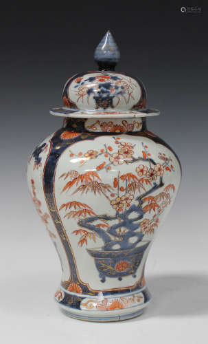 A Japanese Imari porcelain jar and domed cover, early 18th century, of baluster form, painted and