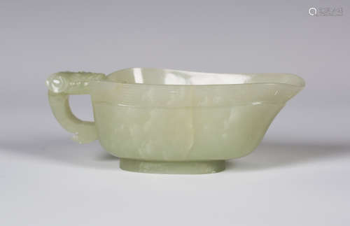 A Chinese pale celadon jade libation cup, probably 20th century, carved in low relief with a keyfret
