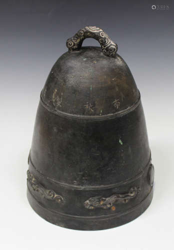 A Chinese brown patinated cast bronze bell, probably Qing dynasty, incised with a band of characters