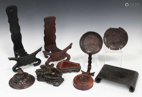 A collection of six Chinese hardwood stands, 19th century and later, comprising three dish/plate