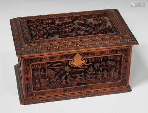 A Chinese Canton sandalwood rectangular box and cover, late Qing dynasty, the hinged lid carved in