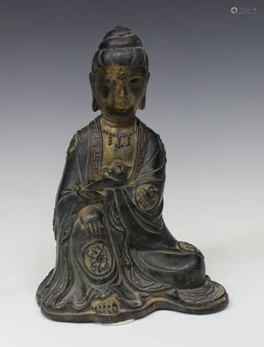 A Chinese Ming style bronze figure of a seated bodhisattva, Qing dynasty, modelled seated holding