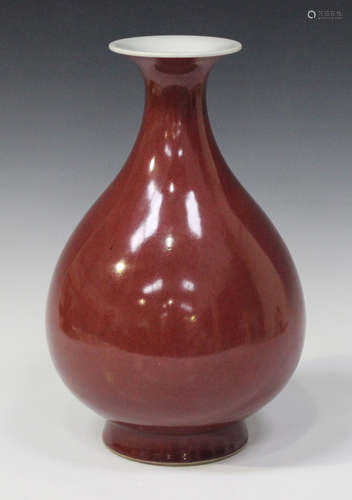 A Chinese sang-de-boeuf glazed porcelain vase, mark of Tongzhi but later, of pear form with flared