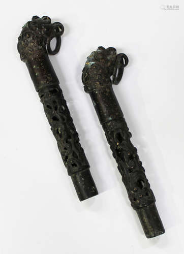 A pair of Chinese archaistic bronze fittings, each cast and pierced cylindrical shaft with slip-on