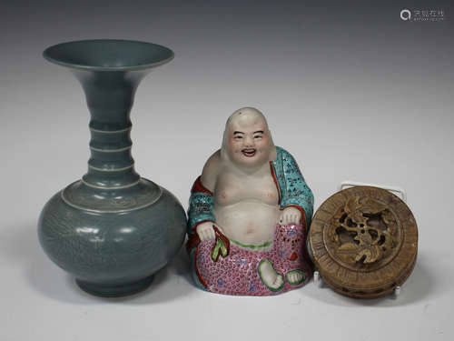 A Chinese famille rose enamelled biscuit porcelain figure of Buddha, 20th century, modelled seated