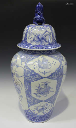 A Japanese Arita blue and white porcelain jar and domed cover with Buddhistic lion finial, Meiji