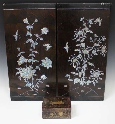 A pair of Chinese mother-of-pearl inlaid lacquer rectangular panels, 20th century, each decorated