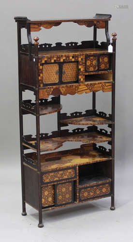 A Japanese parquetry inlaid display side cabinet, Meiji period, fitted with an arrangement of