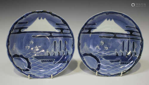 A pair of Japanese Arita blue and white porcelain plates, Edo period, each painted with a stylized