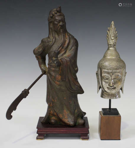 A Chinese bronze figure of Guandi, 20th century, the god of war modelled standing, holding a dao (