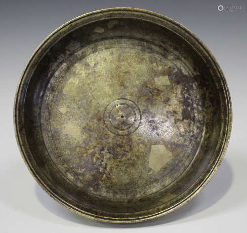 A South-east Asian patinated bronze circular dish, 19th/20th century, of turned circular form with