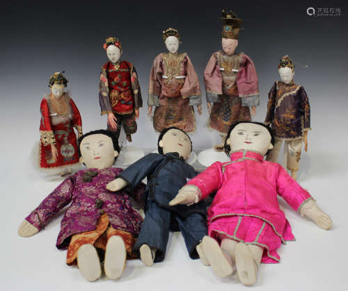 A group of seven Chinese opera dolls, late Qing dynasty, each with original silk embroidered