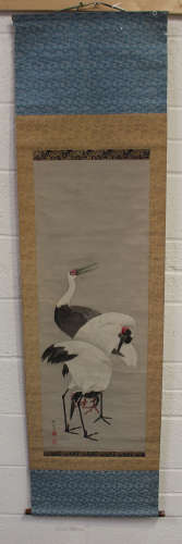 A Japanese hanging scroll painting, Meiji period, depicting three red-capped cranes, black painted