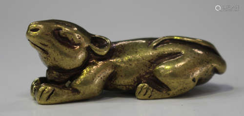 A Chinese gilt bronze figure of a squirrel, modelled in a recumbent pose, length 4.1cm.Buyer’s