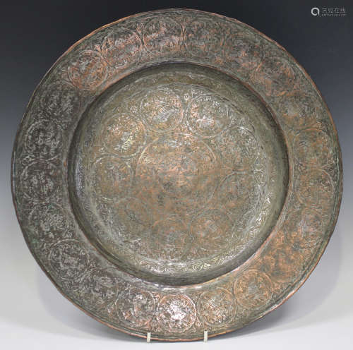 A Safavid tinned-copper circular dish, probably 18th century, the central well and wide rim engraved