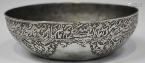 A Persian tinned-copper circular bowl, probably late 19th century, the exterior engraved with a band