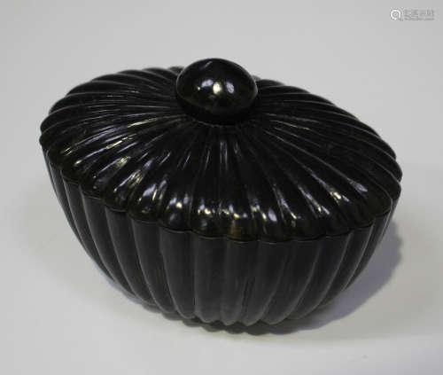 A Chinese Mughal style jade oval box and cover, modern, of lobed oval form, the stone of dark