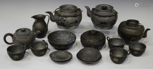 A Chinese pewter mounted and carved coconut shell part tea set, late Qing dynasty, comprising