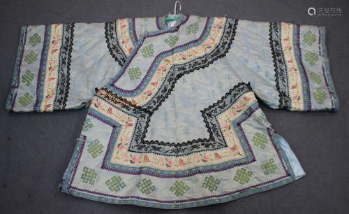 A Chinese pale blue silk embroidered winter jacket, early 20th century, worked in coloured threads