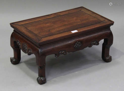 A Chinese hardwood occasional table, late 19th century, the rectangular panelled top above a