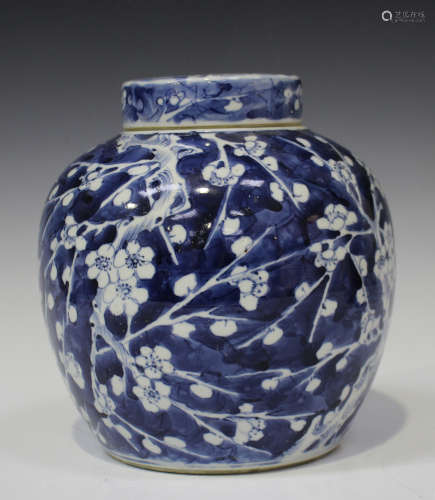 A Chinese blue and white porcelain ginger jar and cover, late 19th century, painted with prunus