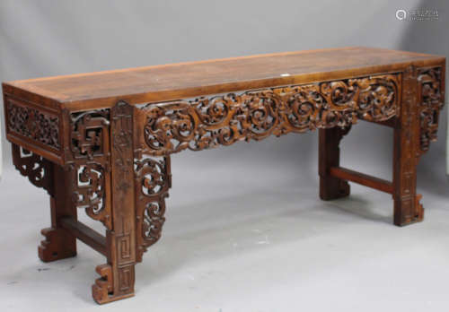 A Chinese hardwood altar table, 20th century, with rectangular panelled top, the front apron