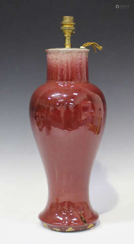 A Chinese sang-de-boeuf glazed vase, Qing dynasty, of baluster form, height 38.5cm (repair to neck