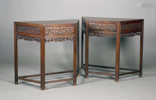 A pair of Chinese hardwood side tables, late 19th century, each panelled top above a single