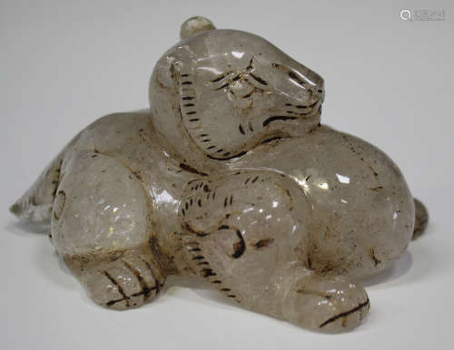 A Chinese rock crystal carving of a mythical beast, 20th century, modelled in a recumbent pose,