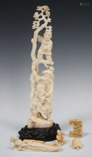 A small group of Oriental ivory, late 19th century, comprising a Japanese recumbent winged goddess