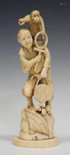 A Japanese marine ivory okimono carving, Meiji period, carved and pierced in the form of a monkey