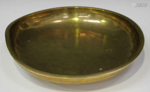 A Chinese gilt bronze circular bowl, mark of Qianlong but probably later Qing dynasty, of shallow
