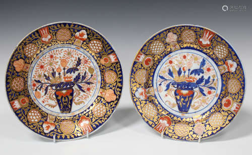 A pair of English porcelain Imari palette plates, probably Coalport, circa 1820, each with a central