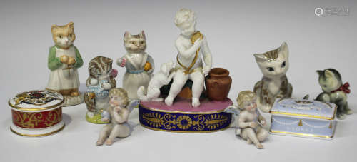 A French porcelain figure group, mid-19th century, modelled as a bisque putto teasing a dog with a