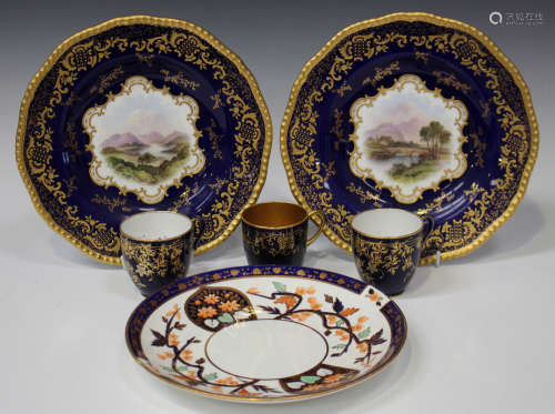 A pair of Coalport porcelain plates, late 19th/early 20th century, painted with titled landscape