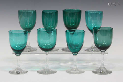A matched set of eight Bristol green wine glasses, late 19th century, height of tallest 13.4cm.