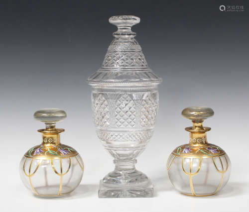 A pair of Art Nouveau gilded and enamelled glass scent bottles and stoppers, each globular body