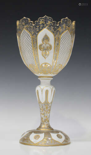 A Bohemian white overlay and cut goblet shaped glass vase, late 19th century, the cup shaped bowl