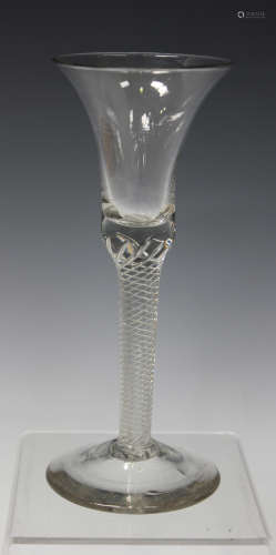 An airtwist stem wine glass, mid-18th century, the bell shaped bowl raised on a multi-series